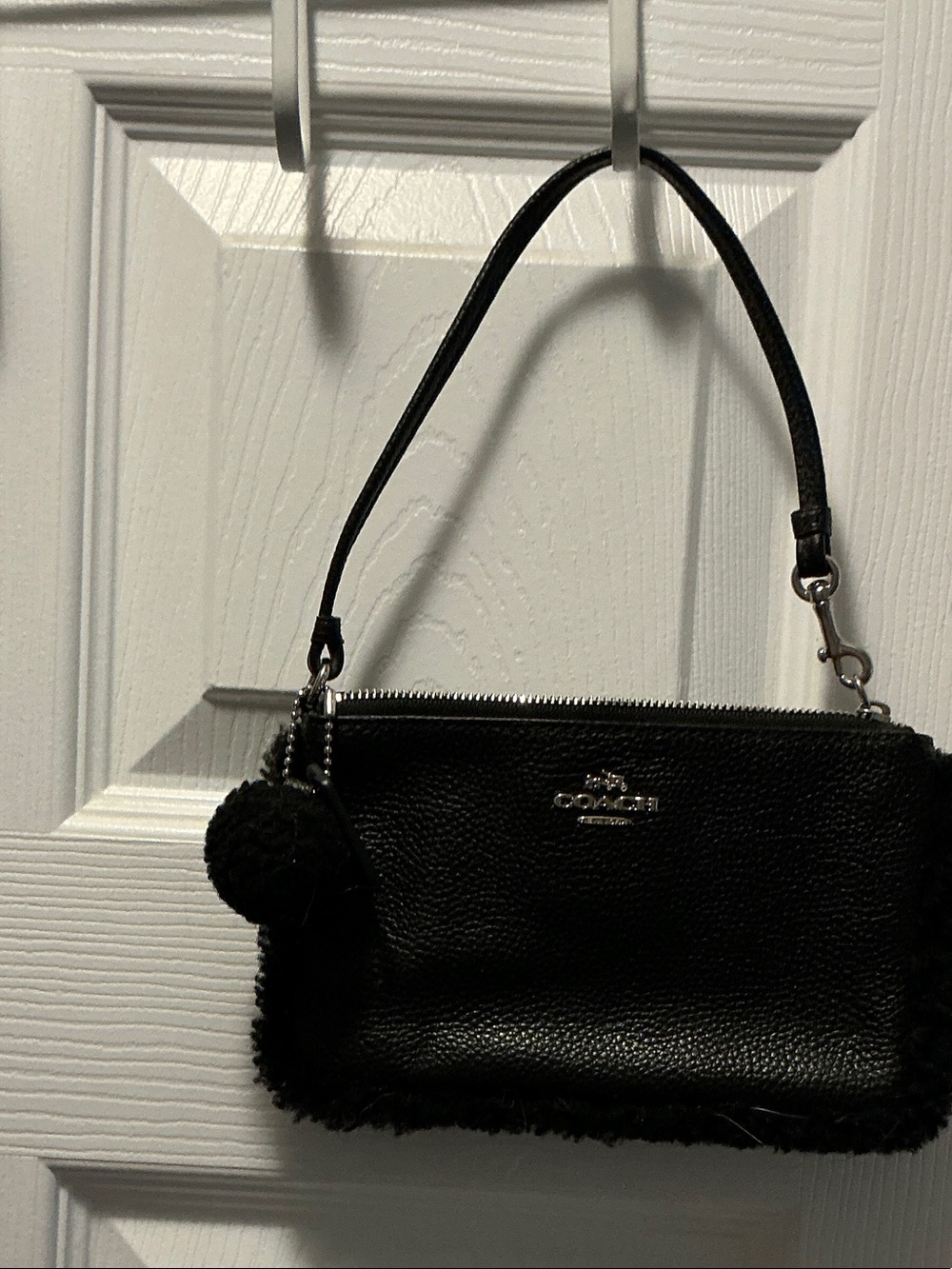 Coach Black Leather Pom Pom Wristlet Clutch